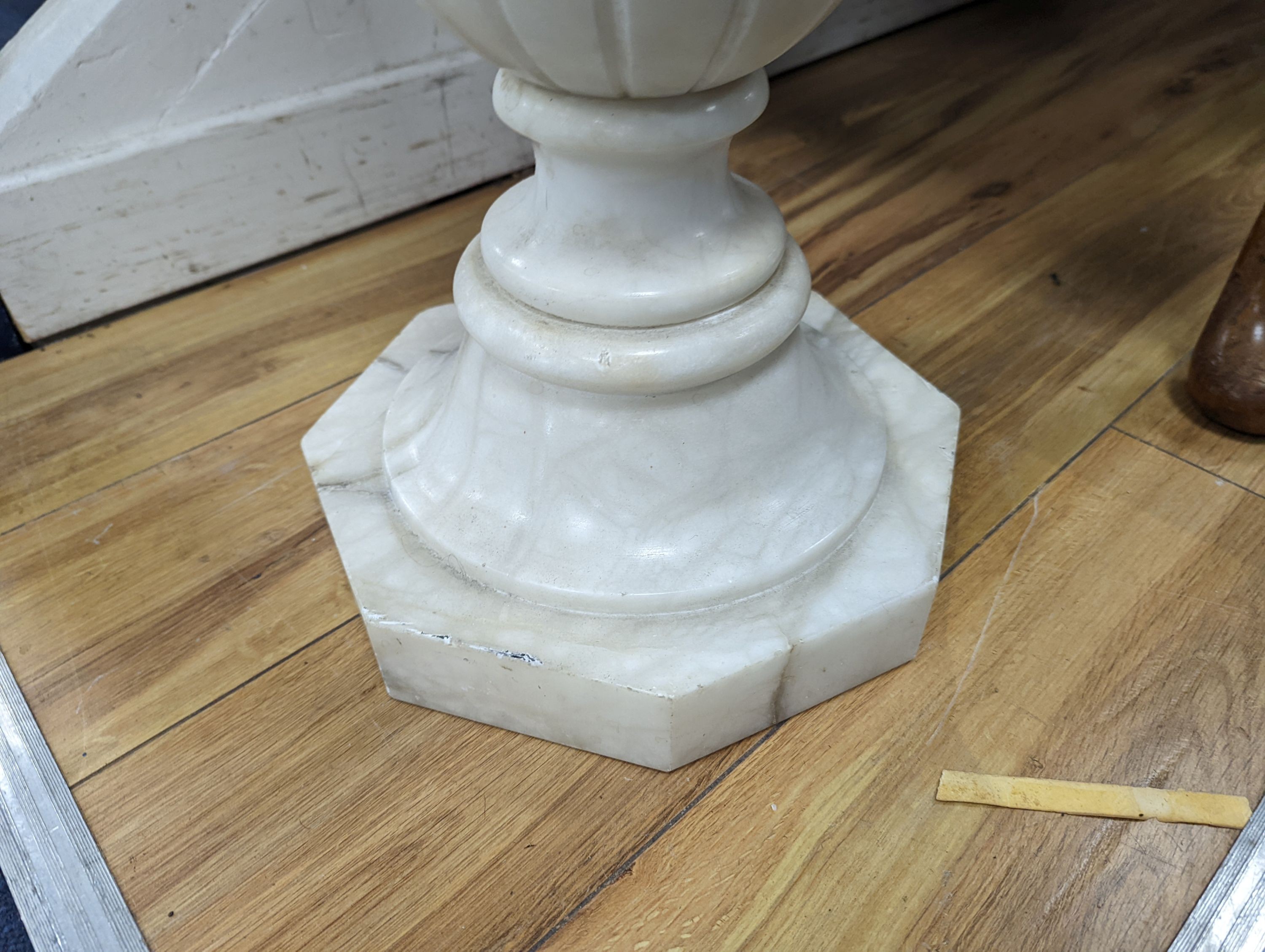 A carved alabaster pedestal on octagonal base, height 108cm